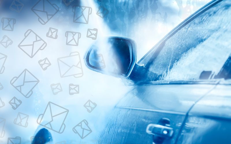 image of a car being sprayed with a blue hue and an overlay of email icons