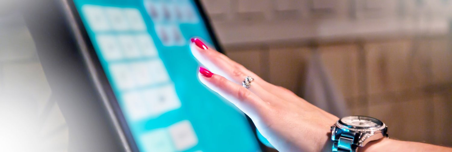 Woman's hand touching a screen