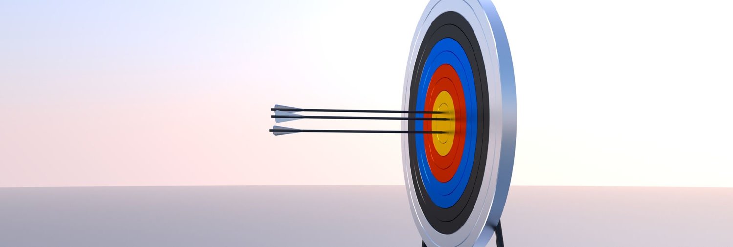 an arrow sticking in the bullseye of a dart board