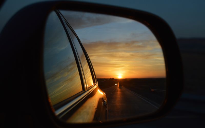 Sunset in side view mirror