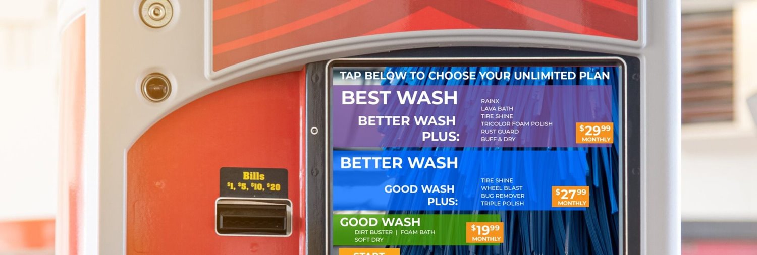close up shot of a car wash pay station displaying unlimited car wash plan pricing