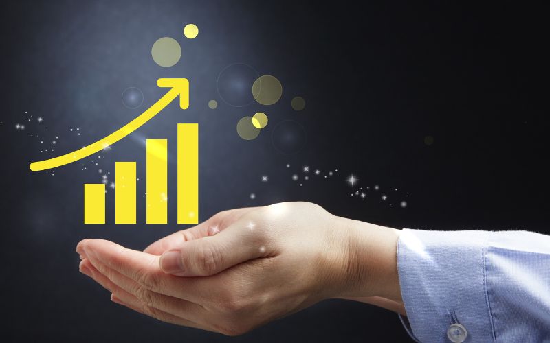 hands holding a increase graph