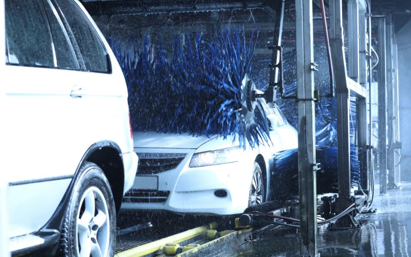 Multiple cars in car wash tunnel