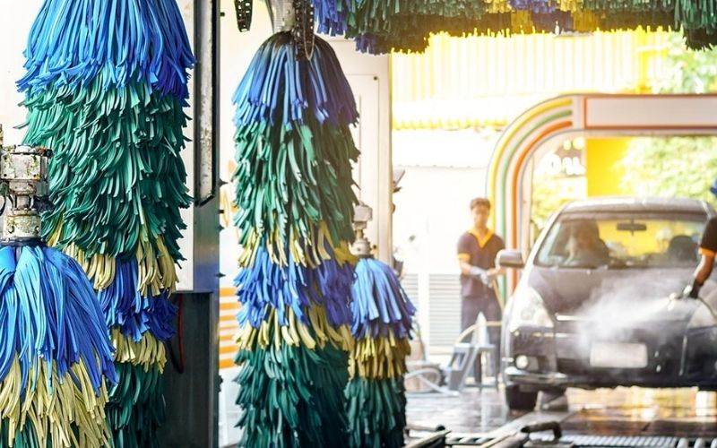 car entering a tunnel car wash