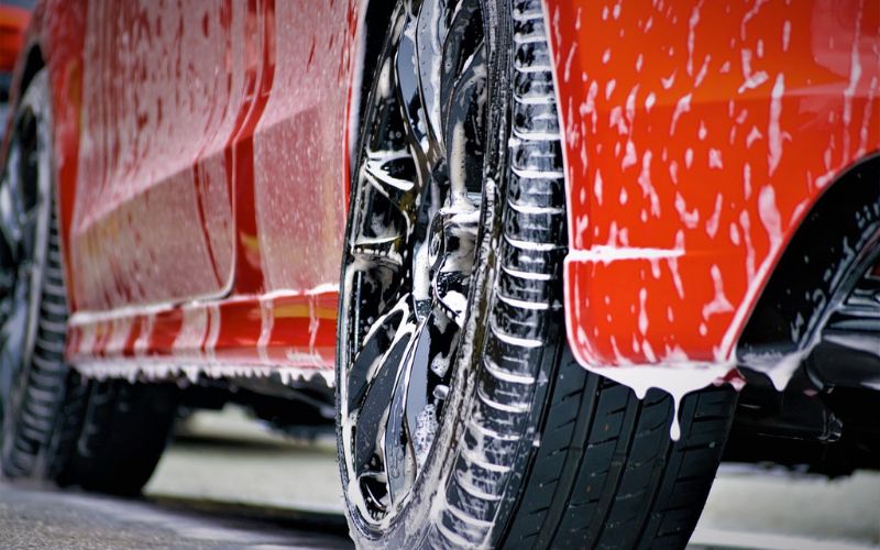 Red car with soap suds